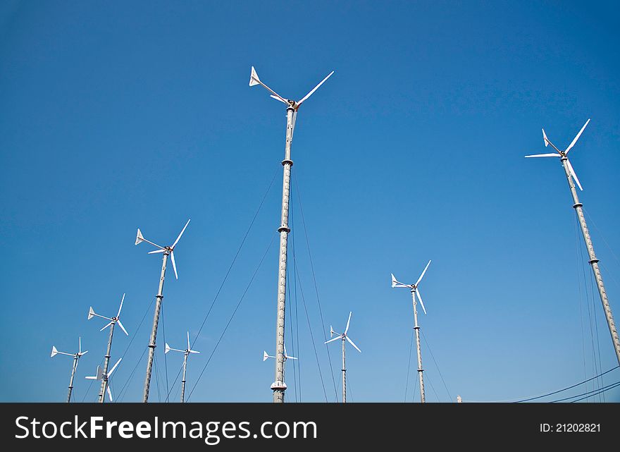 Wind turbine on blue sky background. Wind turbine on blue sky background