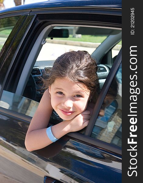 A Girl Looks Out The Car Window