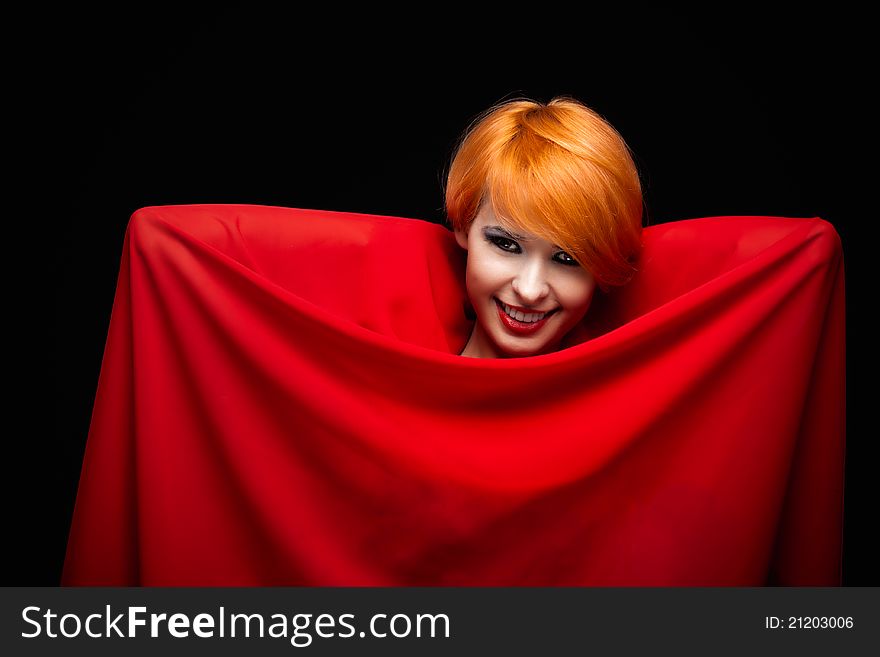 Beautiful girl wrapped in red fabric. Beautiful girl wrapped in red fabric