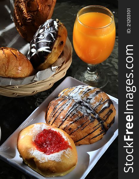 Bread and orange juice as breakfast menu