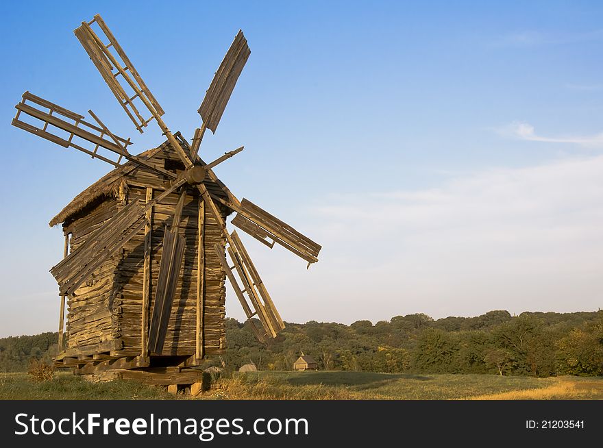 Old wooden windmill at sunset. Old wooden windmill at sunset