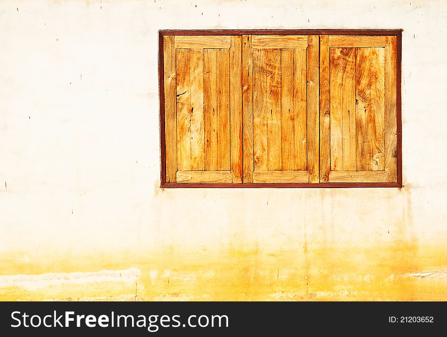 Wooden window on vintage wall background. Wooden window on vintage wall background