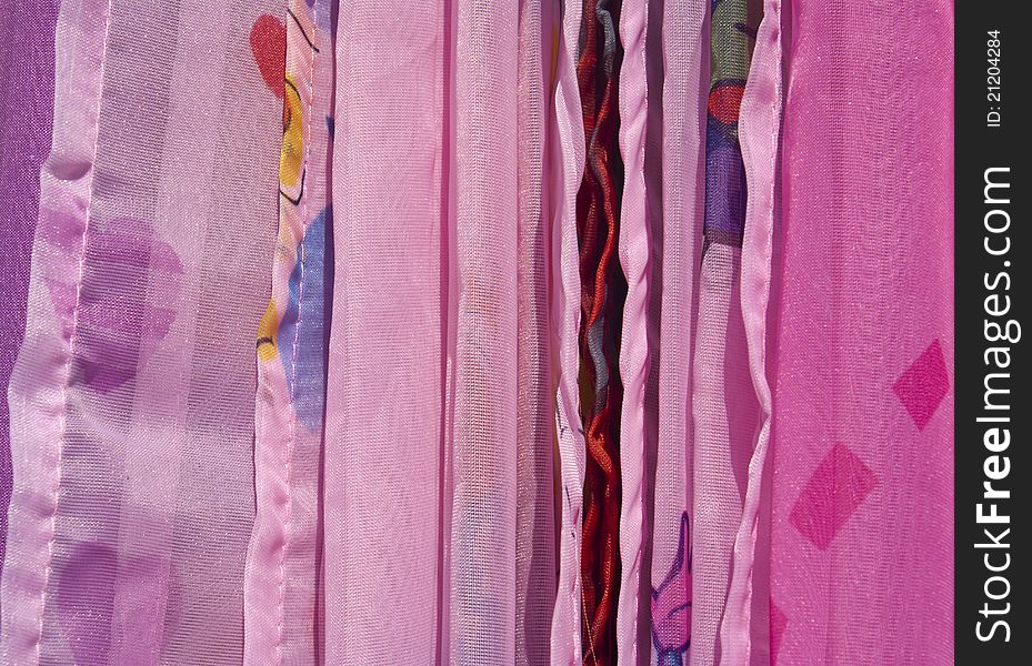 A photo with colorful draperies as background