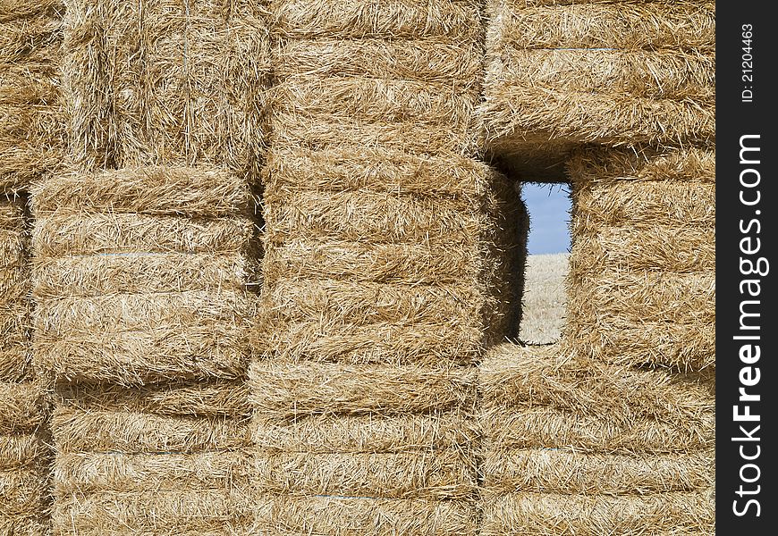 Pile of straw bales with a window to the fields of Palencia, Spain. Pile of straw bales with a window to the fields of Palencia, Spain