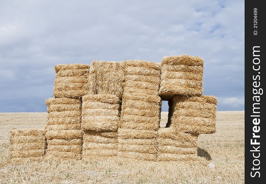 Pile of straw bales with a window to the fields of Palencia, Spain. Pile of straw bales with a window to the fields of Palencia, Spain