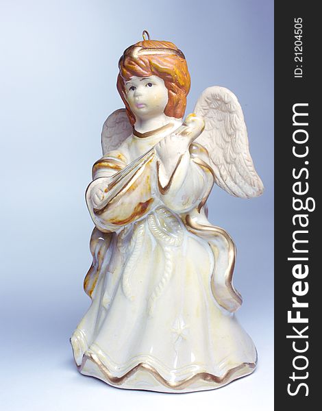 Figurine of an angel on a gray background