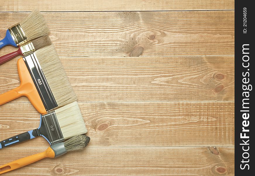 Different tools on a wooden background.