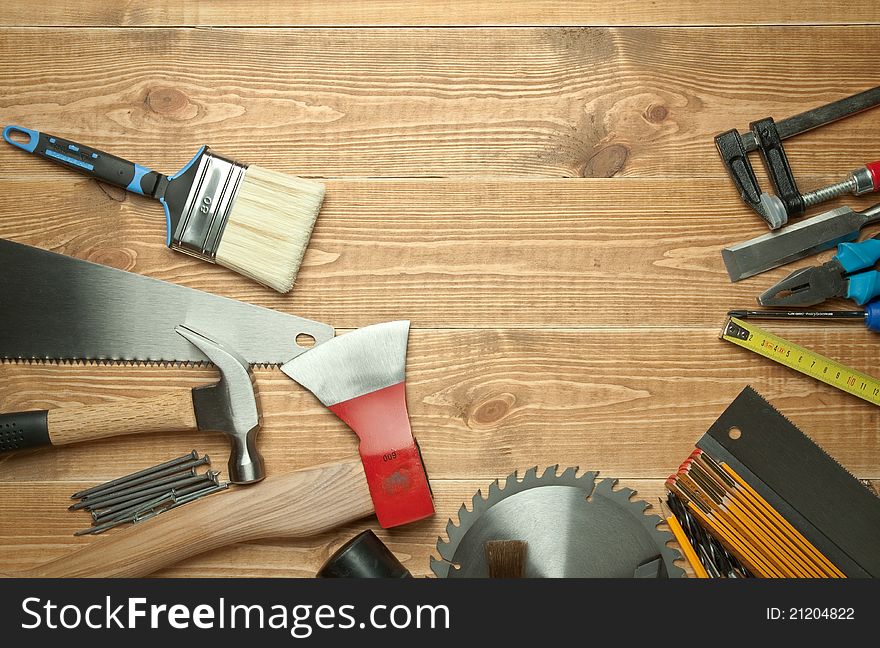 Different tools on a wooden background.