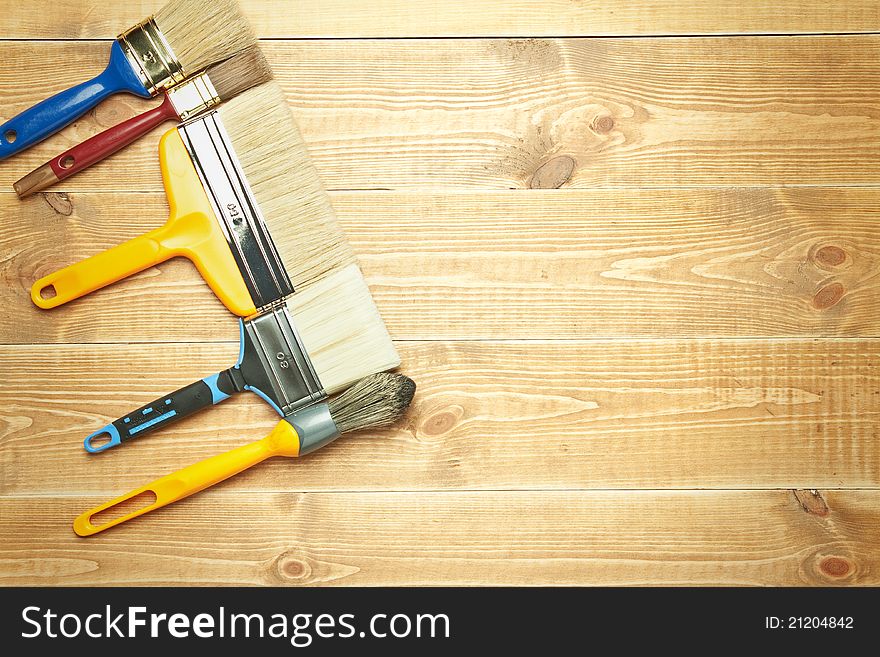 Different tools on a wooden background.