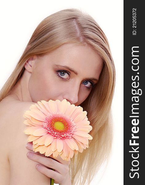 Attractive young woman with a flower. Spring, summer girl, concept of healthy lifestyle metaphor.