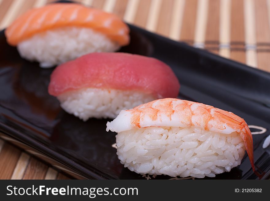 Fish sushi set on sushi plate. Selective focus.