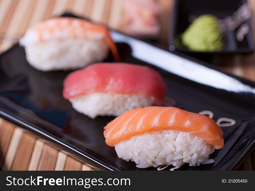 Fish sushi set on sushi plate. Selective focus.