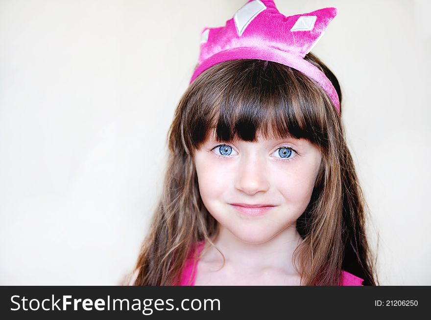 Portrait of beautiful little girl in pink tiara, isolated. Portrait of beautiful little girl in pink tiara, isolated