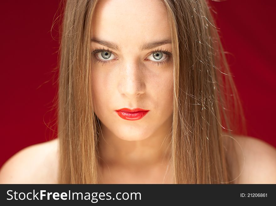Young attractive beautify blond with symmetric long hair on red background.
With red lips and red shirt. Young attractive beautify blond with symmetric long hair on red background.
With red lips and red shirt
