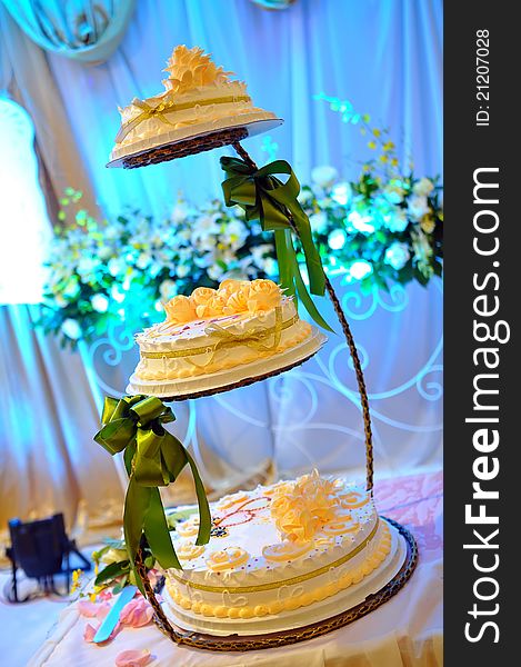 A three-tier wedding cake at the wedding