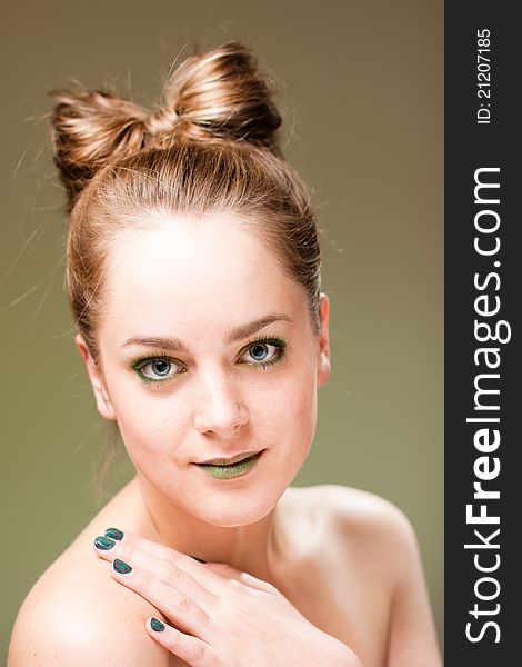 Ecology concept 
beautiful woman with luxury makeup green manicure, lips and cockade. Ecology concept 
beautiful woman with luxury makeup green manicure, lips and cockade