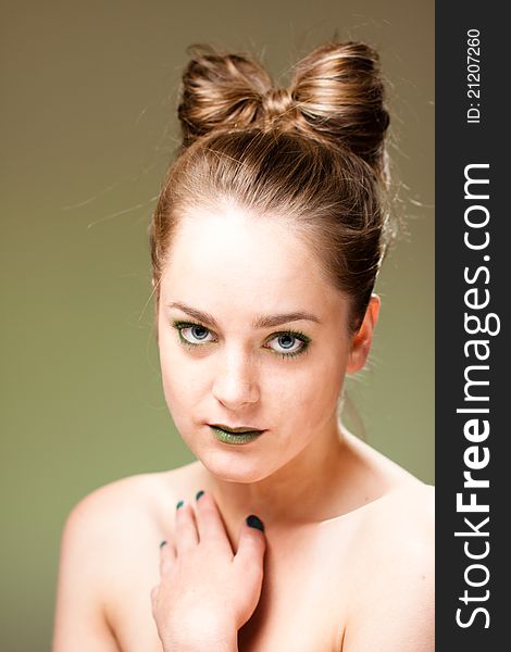 Young attractive blond with green makeup and manicure. Young attractive blond with green makeup and manicure