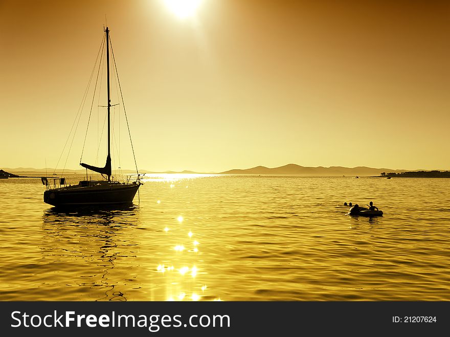 Beautiful sunset with sailboat silhouette. Beautiful sunset with sailboat silhouette