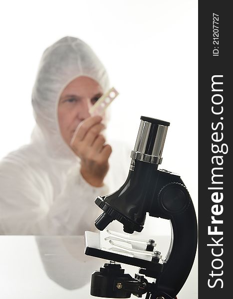 Scientist in the process of exploring through experimant and microscope. Scientist in the process of exploring through experimant and microscope