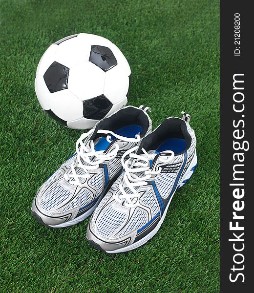 Sports runners situated on artificial turf