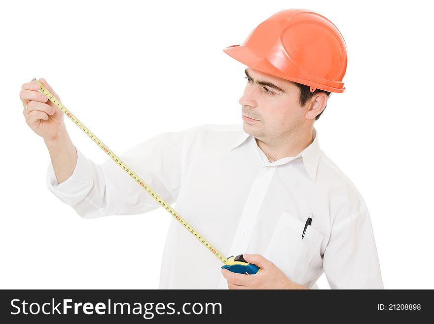 Businessman in a helmet with a meter in his hands on a white background. Businessman in a helmet with a meter in his hands on a white background