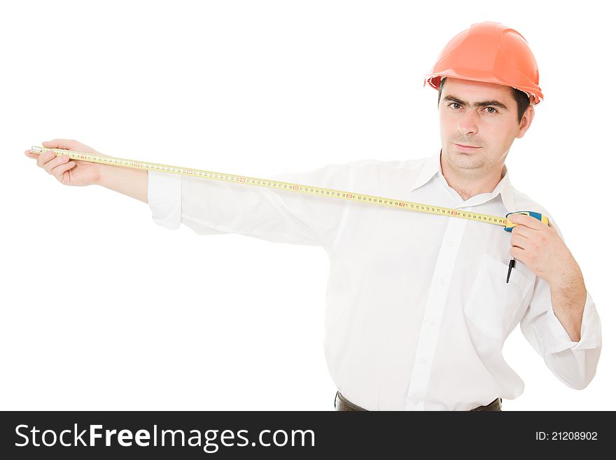 Businessman in a helmet with a meter in his hands.