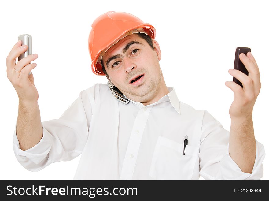 Busy businessman wearing a helmet with a mobile phones on a white background. Busy businessman wearing a helmet with a mobile phones on a white background.