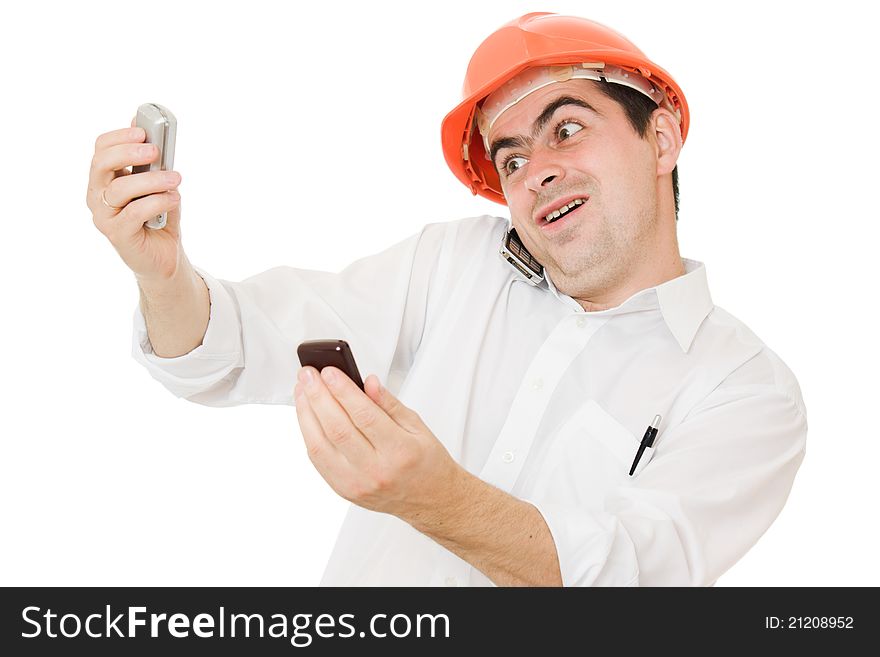 Busy businessman wearing a helmet with a phones