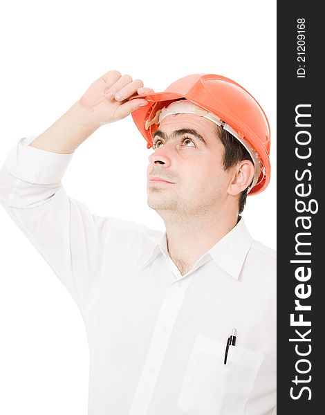 Businessman in a helmet looking up on a white background. Businessman in a helmet looking up on a white background.