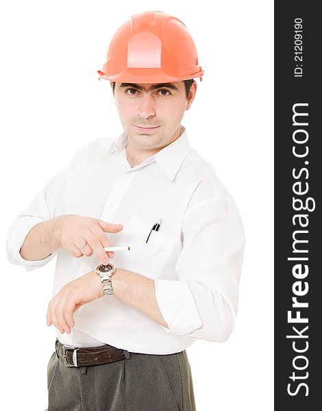 Businessman in a helmet with a cigarette on a white background. Businessman in a helmet with a cigarette on a white background.