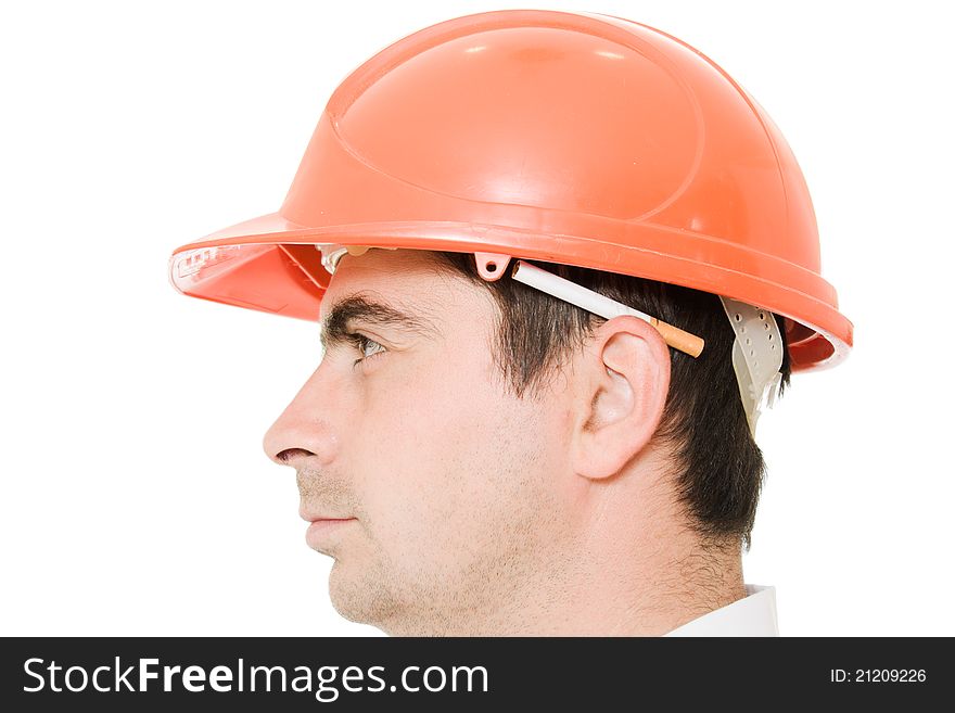 Businessman in a helmet with a cigarette on a white background. Businessman in a helmet with a cigarette on a white background.