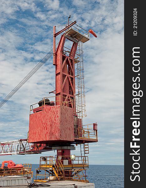 Body and boom of a crane resting on-board the drilling unit offshore Vietnam. Body and boom of a crane resting on-board the drilling unit offshore Vietnam.