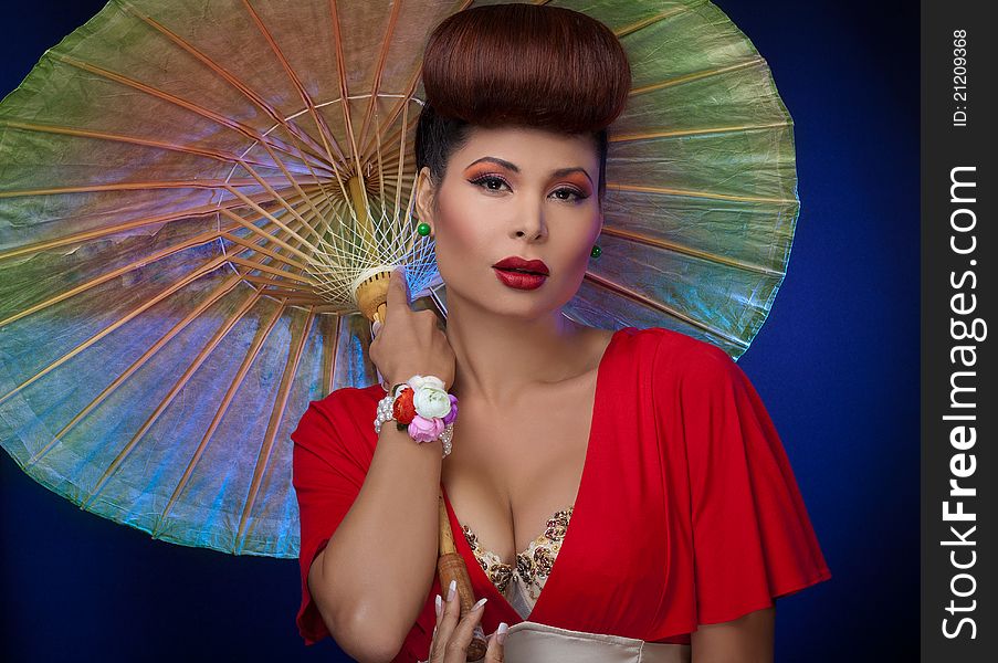 Gorgeous asian woman styled holding parasol. Gorgeous asian woman styled holding parasol