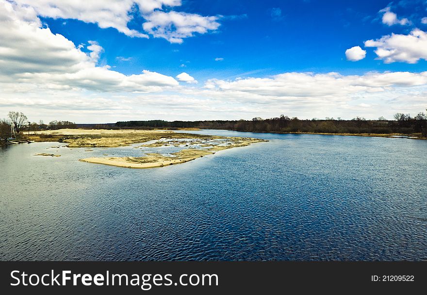 Island With Trees On Blue Cold Lake