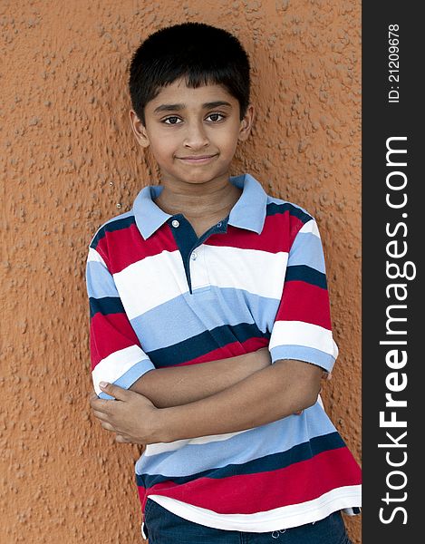 An handsome Indian kid smiling out door