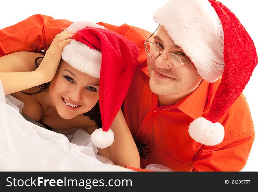 Young lovely  Christmas couple. Isolated over white background. Young lovely  Christmas couple. Isolated over white background