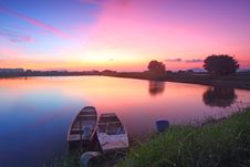 Sunset Along The Pond With Isolated Boats Royalty Free Stock Photo Sunset Along The Pond With Isolated Boats Royalty Free Stock Photo