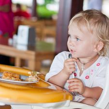 Adorable Baby Eating Cake In A Chair Stock Images Adorable Baby Eating Cake In A Chair Stock Images