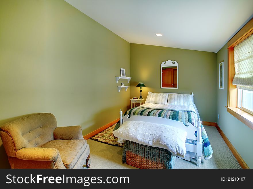 Cozy green bedroom with window and chair. Cozy green bedroom with window and chair