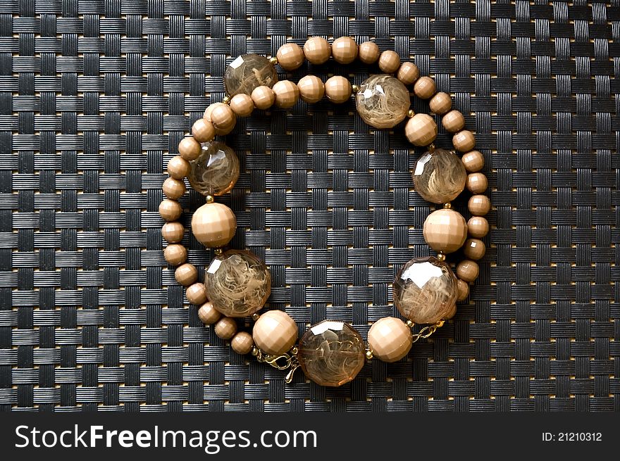 Brown bead necklace in circle shape. Brown bead necklace in circle shape