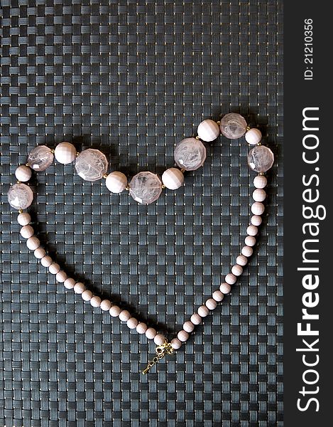 Pink bead necklace in heart shape. Pink bead necklace in heart shape