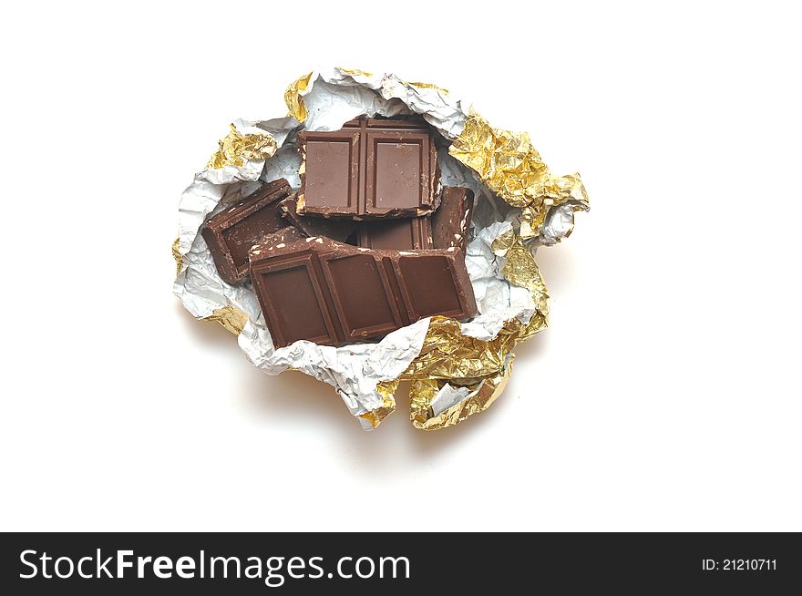 Broken chocolate bar on a white background