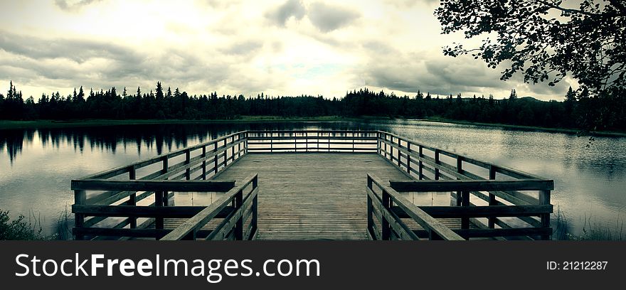 View on a small lake from wooden lookout