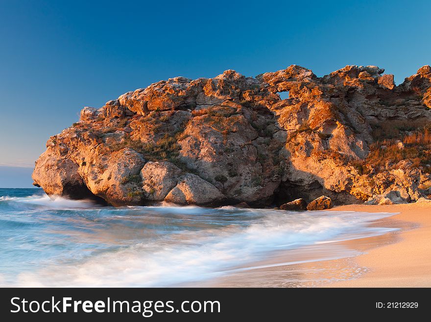 Beautiful rock on the Sea of Azov shore at the sunset. Beautiful rock on the Sea of Azov shore at the sunset