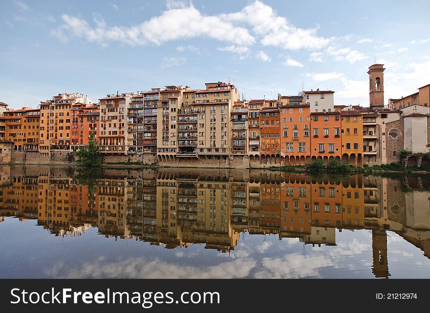 Buildings reflected on the river Arno in Florence. Buildings reflected on the river Arno in Florence