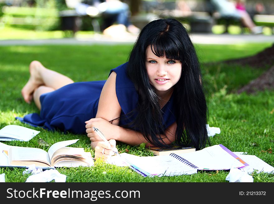 Beautiful Girl Studying In Park