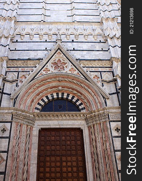 The door of the Cathedral of Siena, medieval church in Siena, Italy