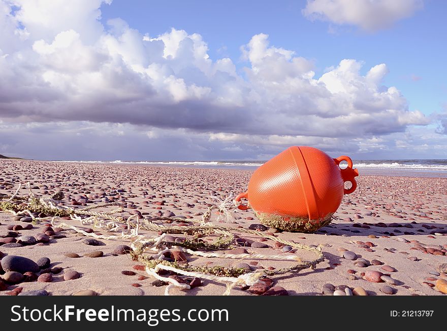 Orange Buoy On The Sea Beach