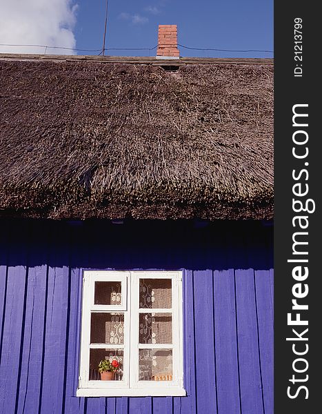 Retro wooden house fragment with window