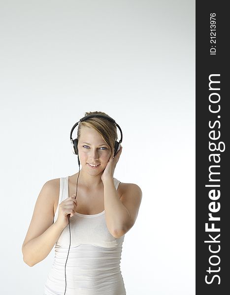 A girl listening to music on her headphones